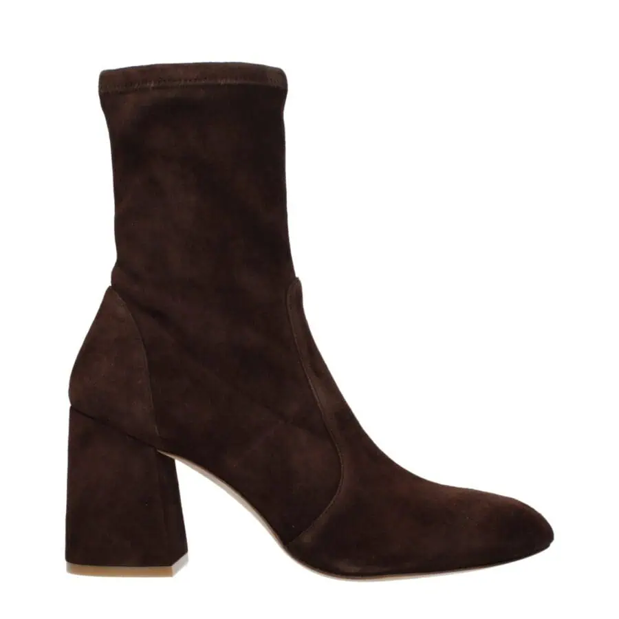 Luxurious dark brown suede ankle boot with a chunky heel, stylishly designed for elegance and comfort. Perfect for fall and winter with a chic, versatile look.