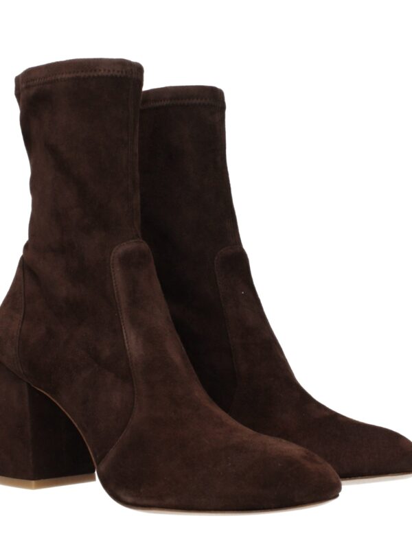 Elegant brown suede ankle boots with chunky heels, perfect for fashion-forward looks and versatile styling.