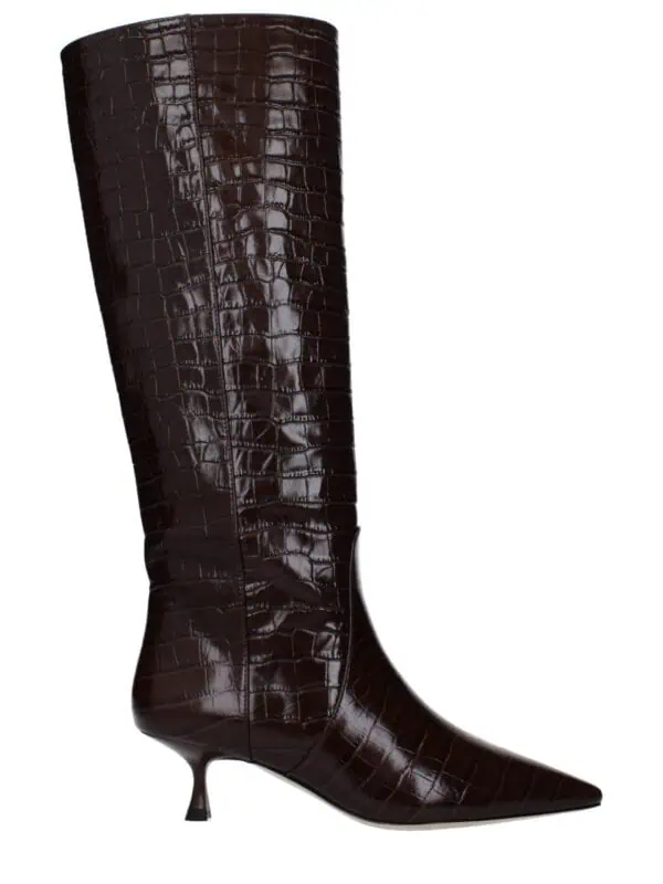 Luxurious brown crocodile-embossed leather knee-high fashion boot with pointed toe and unique, delicate heel for a chic, sophisticated look. Perfect for elevating any stylish outfit.