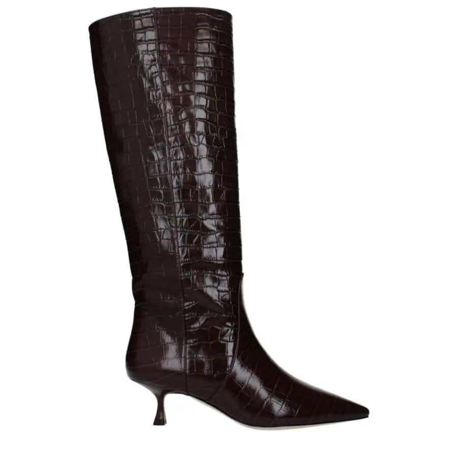 Luxurious brown crocodile-embossed leather knee-high fashion boot with pointed toe and unique, delicate heel for a chic, sophisticated look. Perfect for elevating any stylish outfit.