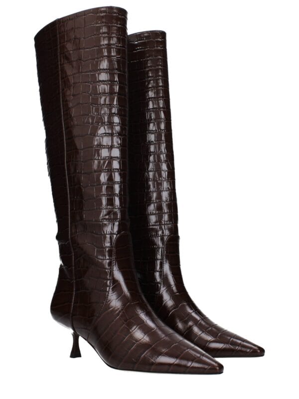 Dark brown crocodile-embossed leather knee-high boots with pointed toes and stiletto heels, perfect for a luxurious and stylish look.