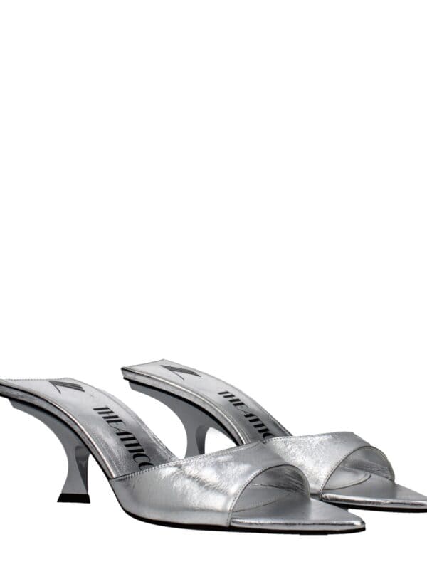 Silver metallic high-heel mules with open toes, chic design, and branded insoles, perfect for fashionable and elegant outings.