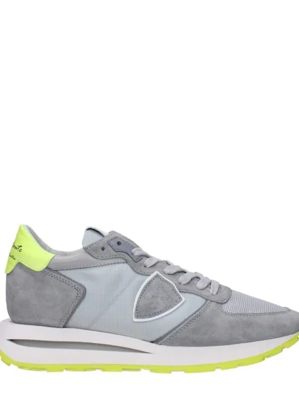 Luxurious grey and neon lime sneakers with a modern design, suede and mesh materials, and a distinctive curved sole for comfort and style. Perfect for casual and sporty looks.
