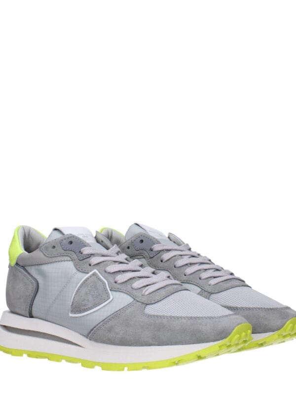 Bright gray sneakers with neon yellow accents, sporty design, cushioned soles, and breathable mesh upper, perfect for casual wear and athletic activities.