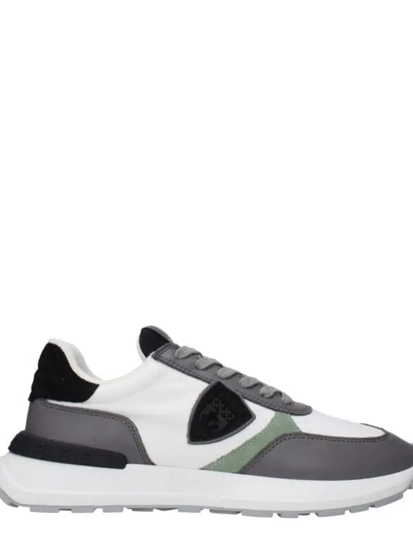 Stylish designer sneakers with a mix of white, gray, black, and green accents, lightweight and comfortable, perfect for Casual and streetwear fashion.