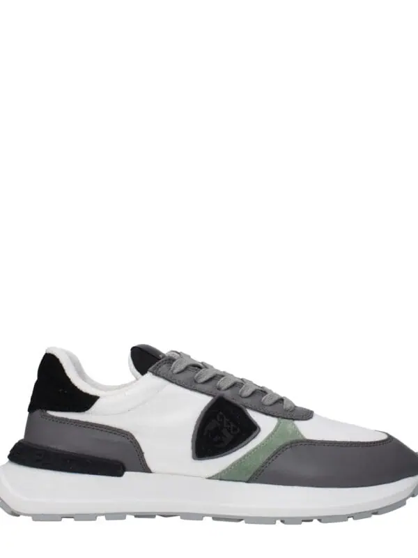1. Stylish men's designer sneakers with black, white, gray, and green accents, perfect for casual and athletic wear.