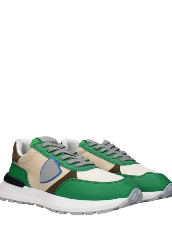 Luxurious designer sneakers with a vibrant green, beige, and brown color palette, featuring breathable materials and trendy style for fashion-forward casual wear.