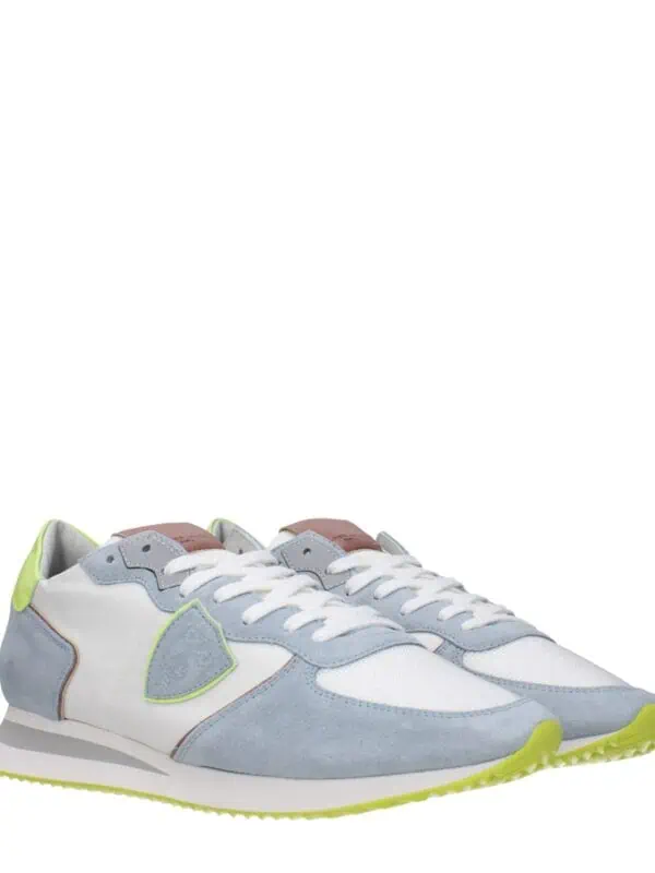 1. Men's luxury sneakers with white, grey, and neon accents, stylishly designed for comfort and high-end fashion.
