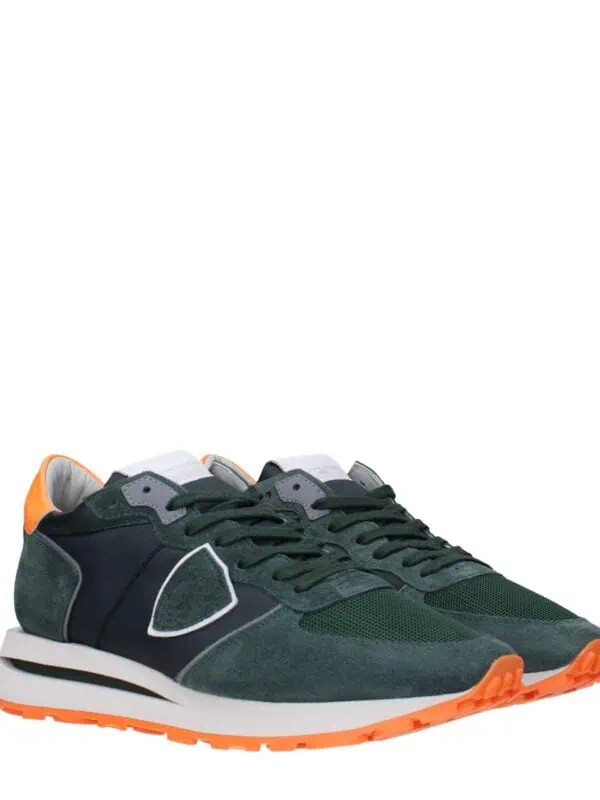 Stylish green and black sneakers with orange accents and cushioned soles, perfect for casual wear and athletic activities.