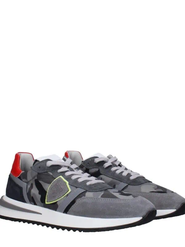 1. Stylish grey, black, and red designer sneakers with modern athletic design and comfortable fit.