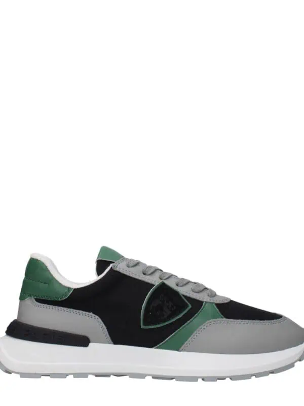 Stylish men's sneakers with black, gray, and green accents, cushioned sole, and breathable design for casual comfort and trendy look. Perfect for everyday wear.