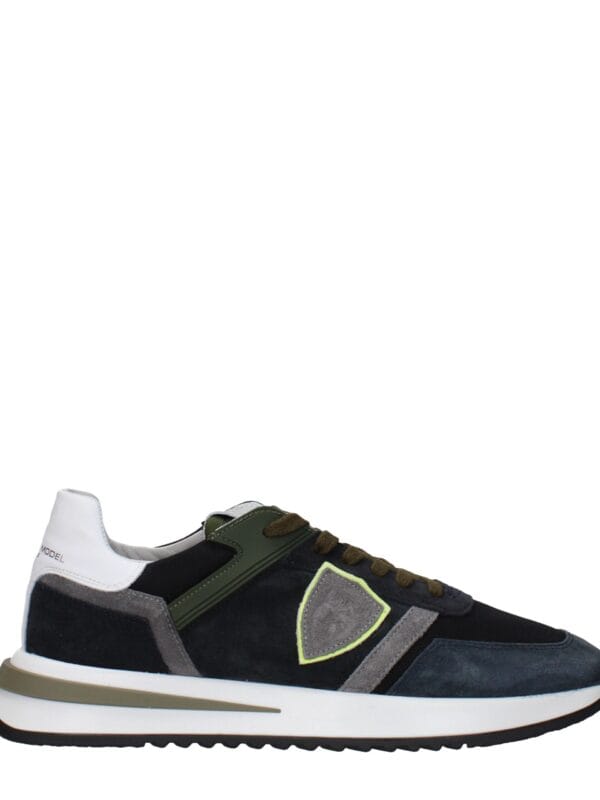 Lux brand men's designer sneaker with navy, grey, black, and white accents, featuring a comfortable sole, stylish detailing, and premium materials for urban casual wear.