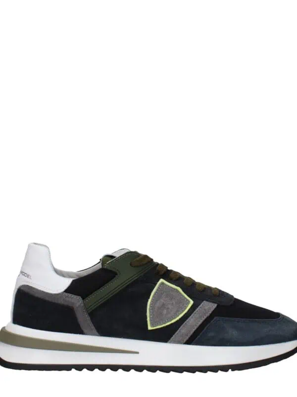 Lux brand men's designer sneaker with navy, grey, black, and white accents, featuring a comfortable sole, stylish detailing, and premium materials for urban casual wear.