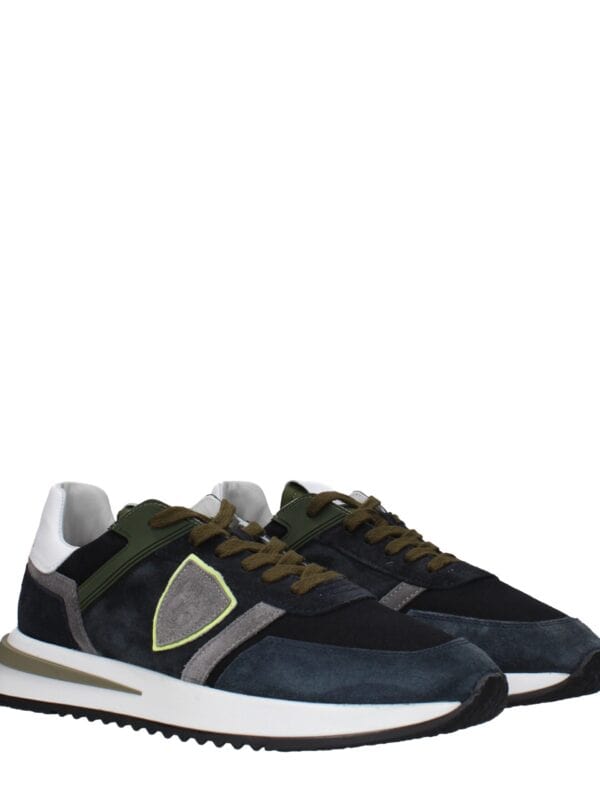 Luxurious men's fashion sneakers featuring a sleek design with black, grey, and white accents, perfect for stylish casual wear and sneaker enthusiasts.