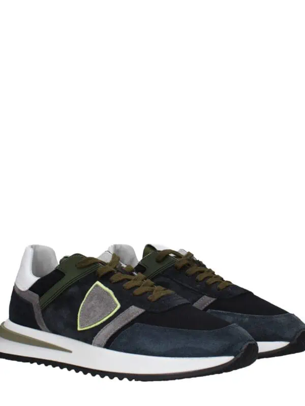 Luxurious men's fashion sneakers featuring a sleek design with black, grey, and white accents, perfect for stylish casual wear and sneaker enthusiasts.