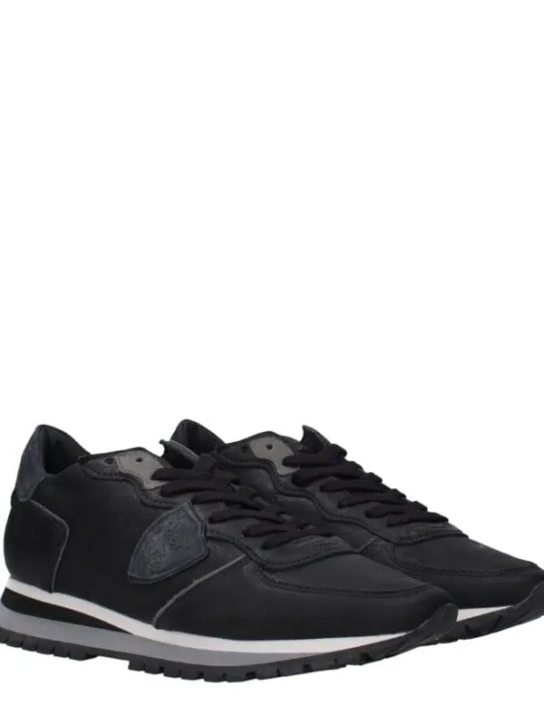 Premium black sneakers with leather accents, comfortable design, and stylish sole. Perfect for casual wear and athletic activities, combining luxury and practicality for everyday use.