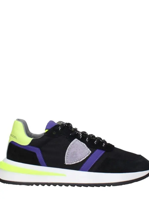 Comfortable black, purple, and neon yellow athletic sneaker with modern design and cushioned sole. Perfect for casual wear or sports activities, stylishly blending vibrant colors.