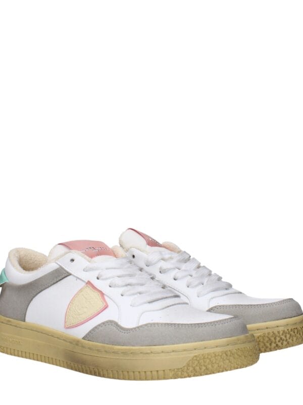 1. Stylish beige, gray, and white sneakers with pastel accents, suede overlays, and comfortable soles, perfect for casual or fashion-forward wear.