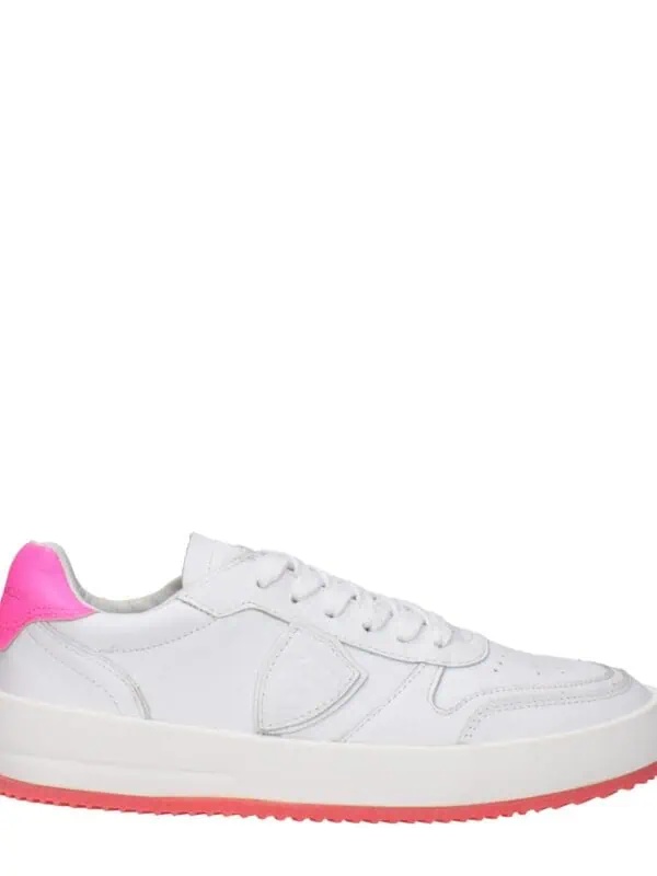 White trendy sneakers with pink accent on heel, casual design, lightweight sole, perfect for daily wear and stylish outfits.