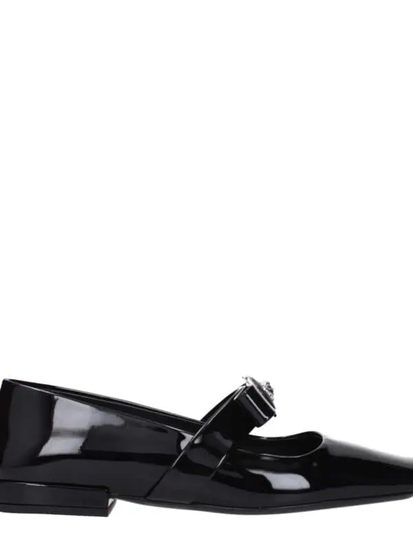 Elegant black patent leather loafer with a stylish buckle detail, perfect for upscale fashion statements and formal occasions.
