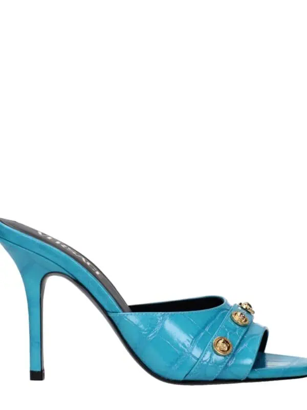 Blue patent leather high-heeled mules with gold embellishments and open toe design, perfect for luxury fashion styling.