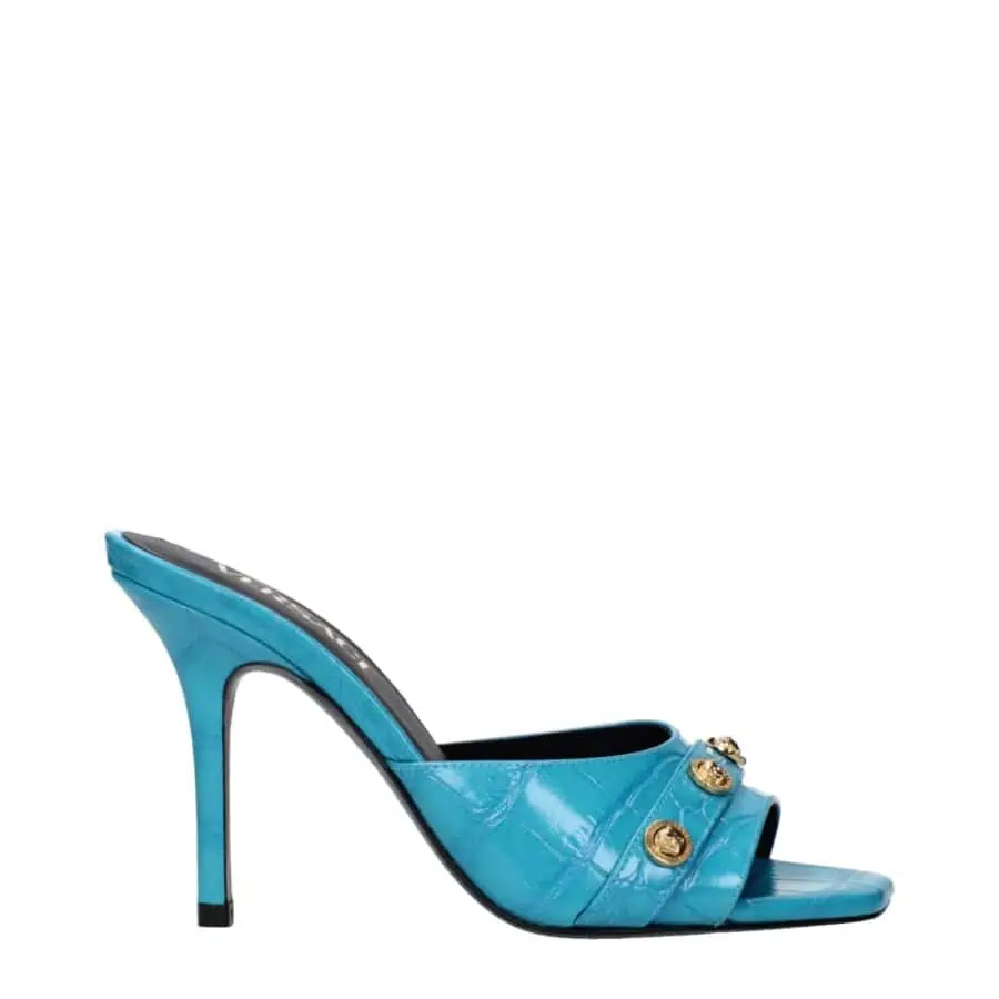 Blue patent leather high-heeled mules with gold embellishments and open toe design, perfect for luxury fashion styling.