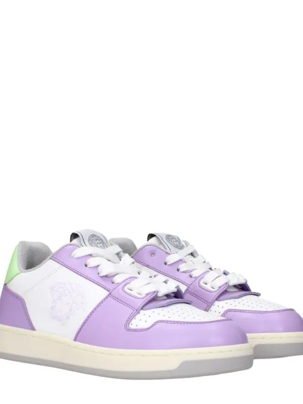 Lavender and white designer sneakers with a lion head logo on the side, featuring a modern and stylish look perfect for casual wear. These luxury sneakers combine comfort and fashion.