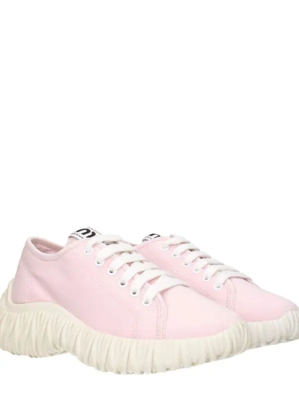Pink casual sneakers with chunky textured soles and white laces, perfect for everyday wear and trendy fashion statements.
