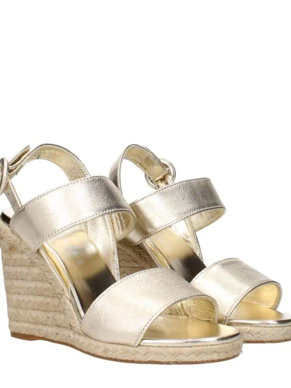 Glamorous gold metallic espadrille wedge sandals with ankle straps and woven jute heels, perfect for stylish summer outfits and special occasions.