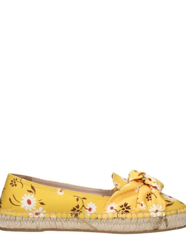 Yellow floral print espadrille flats with bow detail, perfect for casual summer wear.
