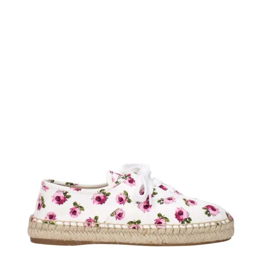 Pink floral-print espadrille sneaker with white laces and natural jute sole, perfect for casual summer outfits and outdoor activities, combines comfort and style.