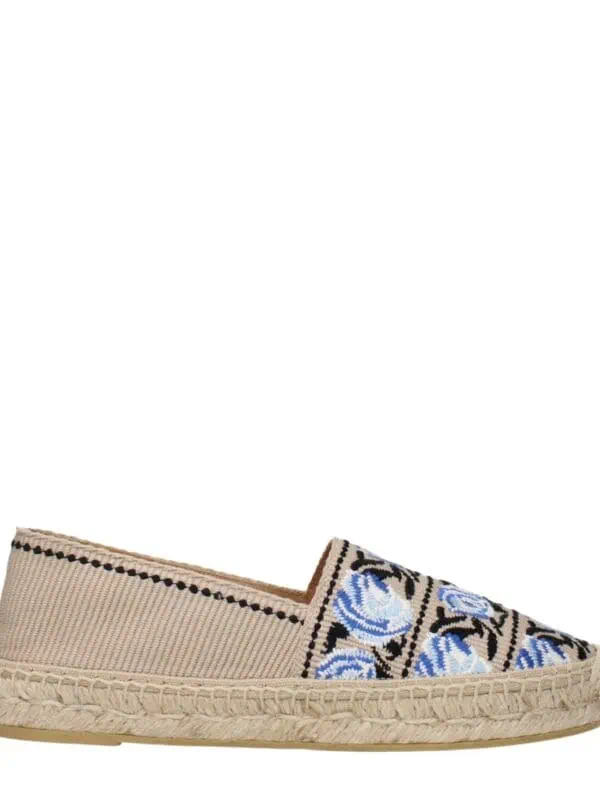 Beige espadrille shoe with embroidered blue and white roses, woven jute sole, and slip-on style, perfect for casual summer look.