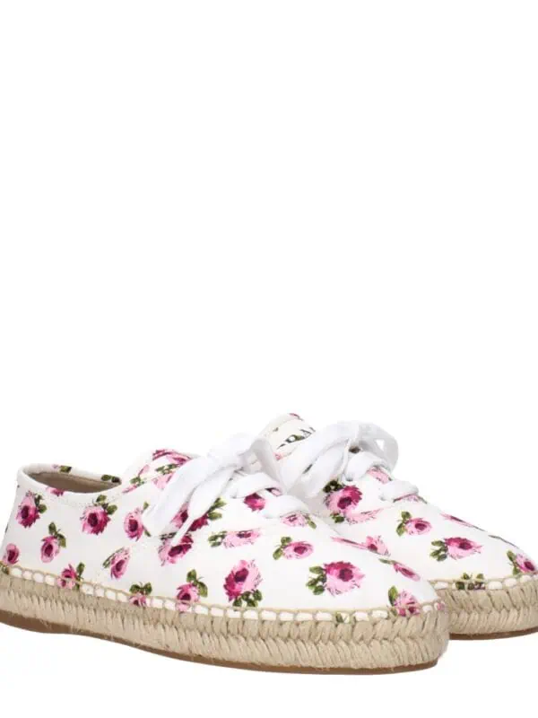 Floral print espadrille sneakers with white laces and woven jute soles, perfect for casual summer wear and chic, comfortable style.
