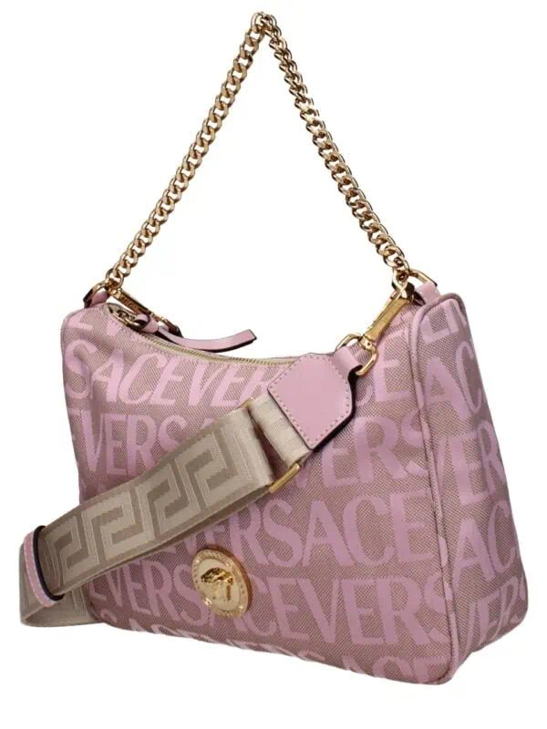 Pink Versace designer handbag with gold chain strap and adjustable logo strap, featuring all-over logo print and elegant hardware accents.