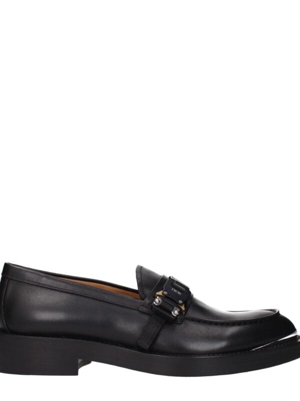 Black leather Dior loafers with a sleek buckle detail and comfortable sole for luxury fashion and style.