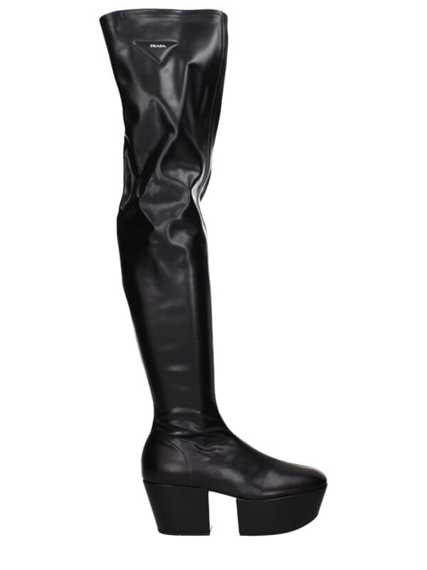 Prada over-the-knee black leather high-heeled platform boots with sleek design and stylish fold-over detail. Perfect for fashionable, bold winter or night-out attire.