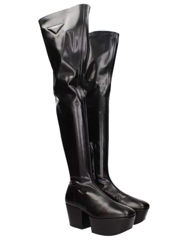 Over-the-knee black leather Prada platform boots with high chunky heels and side zipper, stylish and bold footwear for a luxury fashion statement.