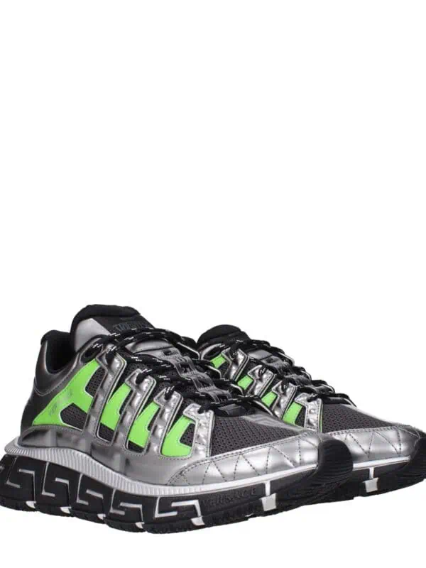 Lux Versace sneakers with metallic silver, black, and neon green accents, featuring a chunky sole and intricate design for luxury streetwear style.