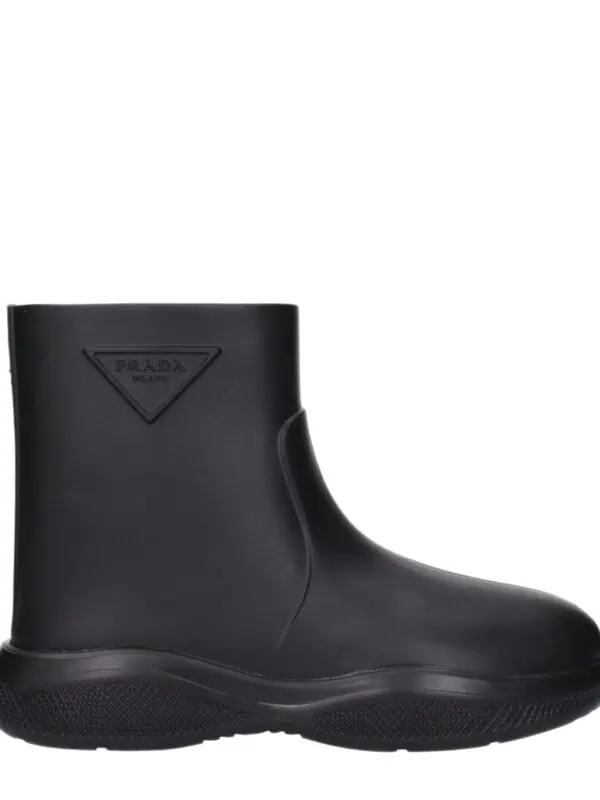 Prada black rubber rain boot with embossed logo, durable waterproof design, perfect for wet weather wear.