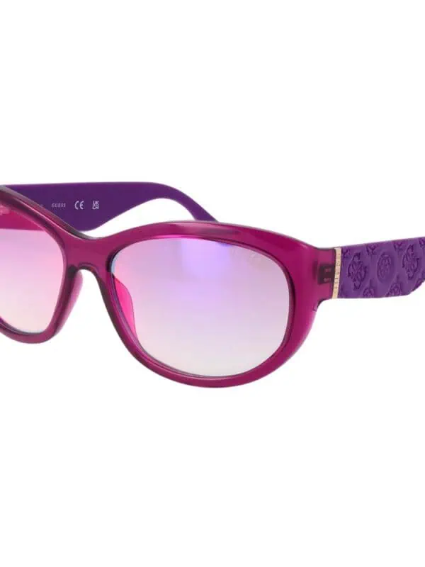 Pink and purple oversized designer sunglasses with embellished temples, perfect for luxury fashion statements.