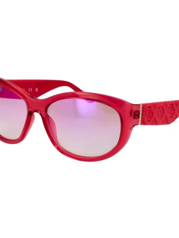 Red fashionable designer sunglasses with purple-tinted lenses for women.