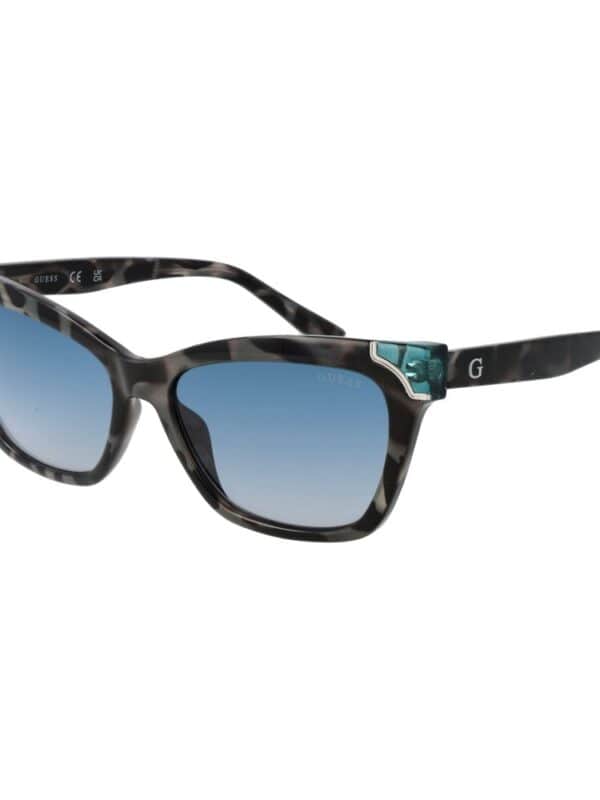 Stylish Guess tortoise shell sunglasses with blue gradient lenses, perfect for a fashionable summer look. Durable frame with signature details and UV protection.
