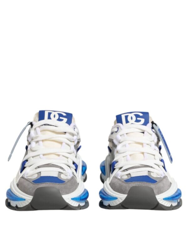Blue and white luxury sneakers with grey accents, branded with DG logo, athletic style, modern design, premium materials, and unique detailing for high-end fashion.
