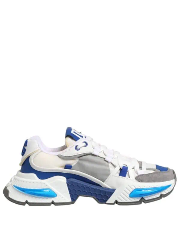 White and blue designer sneaker with chunky sole, synthetic and suede materials, stylish streetwear footwear, inspired by modern athletic trends.