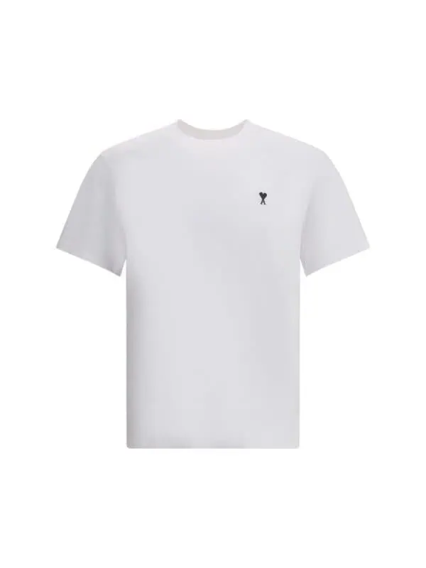 Minimalist white T-shirt with small black heart logo on chest, perfect for casual luxury style.