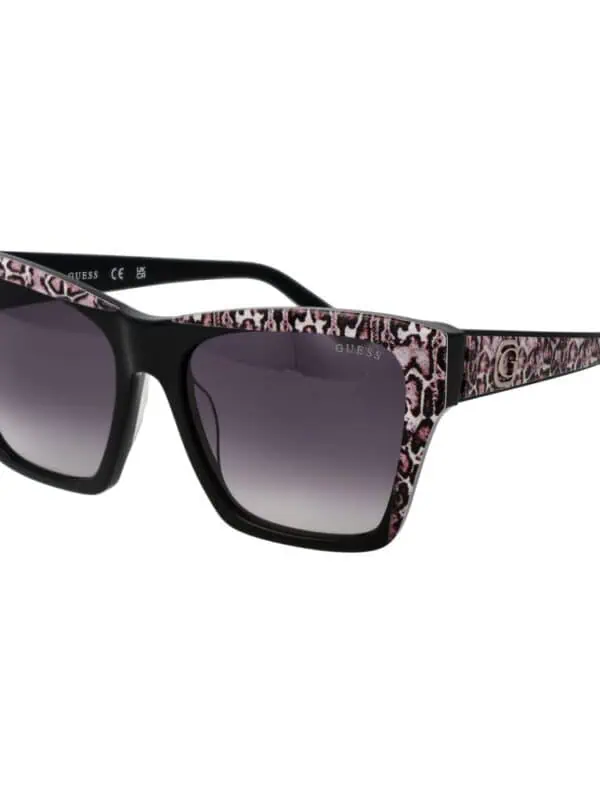 Black and pink animal print oversized sunglasses with gradient lenses, stylish and bold fashion accessory from Guess.