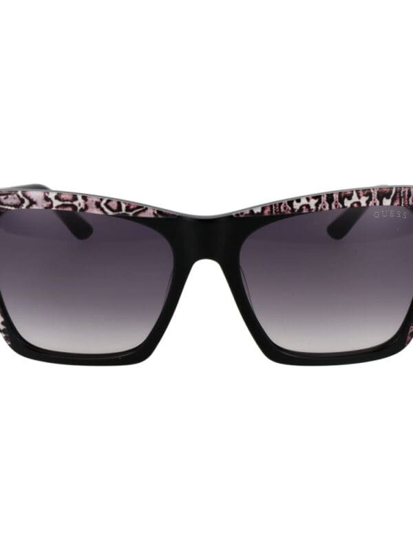 Black and pink animal print sunglasses with tinted lenses from Guess.