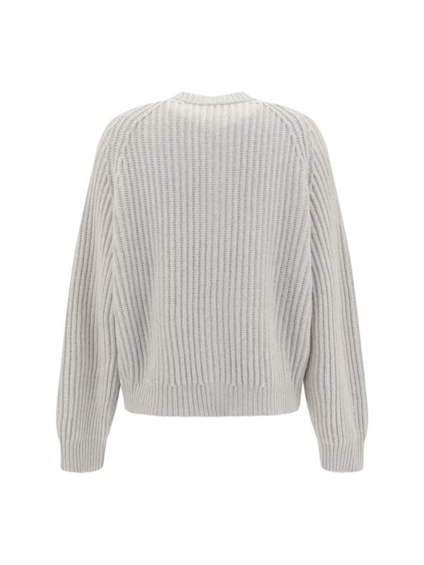 Soft white knit oversized sweater with ribbed detailing and long sleeves for a cozy, stylish look. Perfect for casual wear and layering in colder weather.