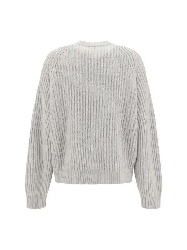 Soft white knit oversized sweater with ribbed detailing and long sleeves for a cozy, stylish look. Perfect for casual wear and layering in colder weather.