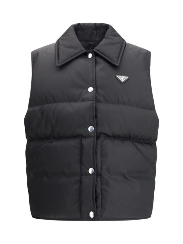 Lux Brands black puffer vest with side pockets and brand logo, versatile outerwear for a stylish and cozy look. perfect for layering in colder weather. lightweight and warm.